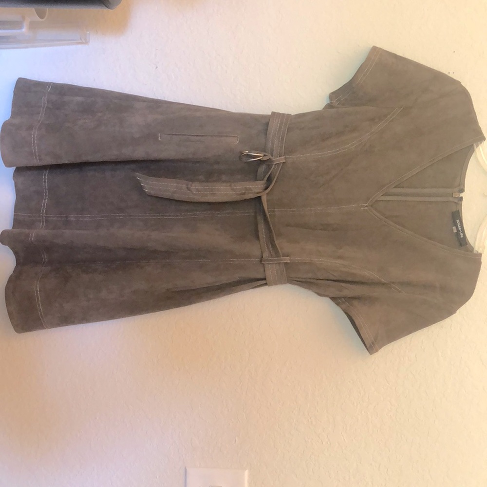 Very flattering green suede dress with pockets. Hidden back zip 35 inches long.